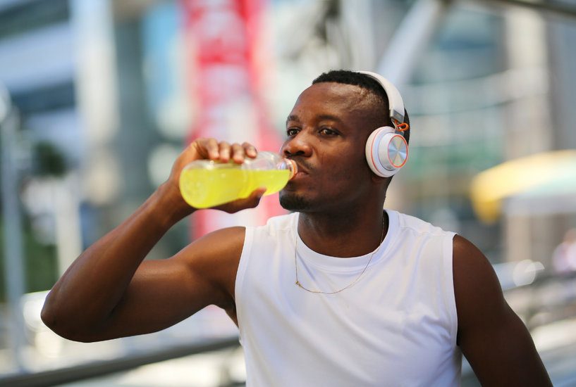 Man drinking water trying to hydrate after exercise