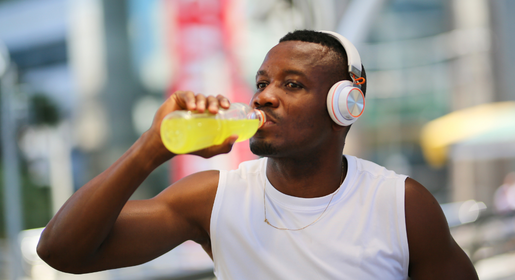 Man drinking water trying to hydrate after exercise