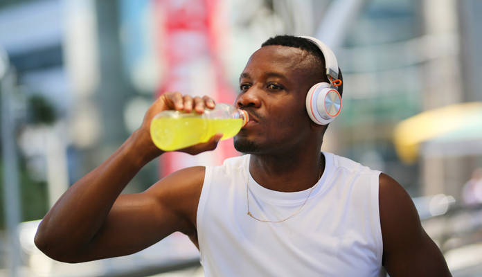 Man drinking water trying to hydrate after exercise